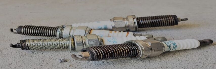 Image of a spark plug, a vital component in an internal combustion engine, used to ignite the fuel and air mixture in the combustion chamber.